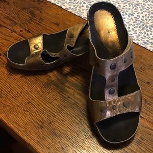 Burnished Gold colored sandals.